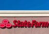 State Farm logo displayed on a building against a blue sky