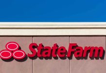 State Farm logo displayed on a building against a blue sky