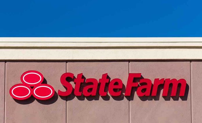 shutterstock_237036724.jpg State Farm logo displayed on a building against a blue sky