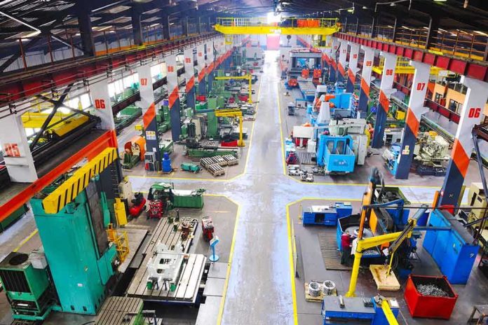 Aerial view of a large industrial workshop filled with various machinery and equipment