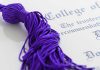 Professor’s SHOCKING Dismissal — Free Speech Crisis? Close-up of a purple graduation tassel next to a diploma