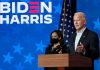 Two people speaking at a Biden Harris event.