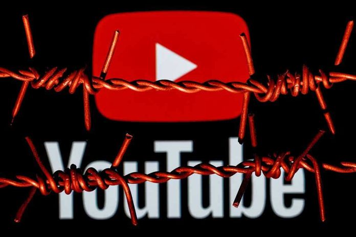 YouTube logo behind barbed wire lines.