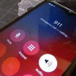 Phone screen showing 911 emergency call in progress.