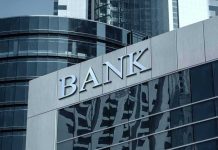 Banks Bet Big on Bitcoin Bank building with reflective glass windows.