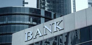 Banks Bet Big on Bitcoin Bank building with reflective glass windows.