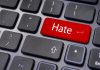 Hate Crime Hotline Becomes Political Tool Close-up of a keyboard with a red key labeled Hate