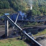 Trump Uses Emergency Powers on Energy Industrial coal processing facility with conveyor belts and smoke stack