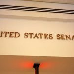 Sign displaying United States Senate in a government building