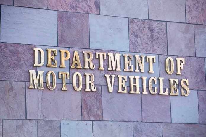 Sign for the Department of Motor Vehicles on a stone wall