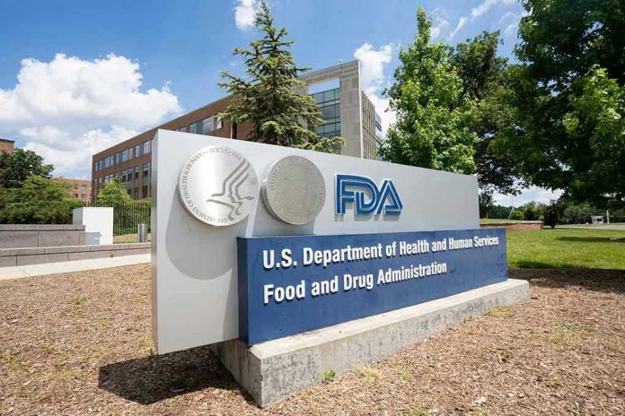 2186134561 FDA building sign with blue sky background.