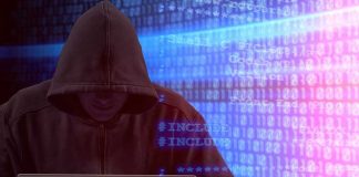 Person in hoodie using laptop, surrounded by digital code.