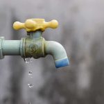 Toxic Scandal: BP Faces Gripping Legal Challenge in Kenya Close-up of a dripping outdoor water faucet