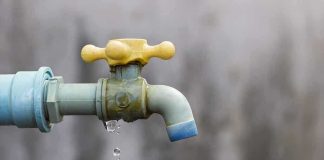 Toxic Scandal: BP Faces Gripping Legal Challenge in Kenya Close-up of a dripping outdoor water faucet