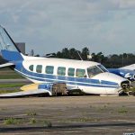 Raúl Castro Indictment: Shocking Sky Ambush Revelations Damaged blue and white small airplane on an airport runway