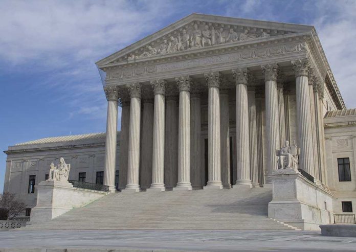 shutterstock_Eletric-car The Supreme Court building featuring large columns and statues