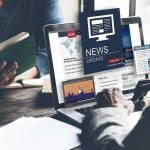 Getty Images Skyrockets on ChatGPT Link-Up Person reading news on a laptop.
