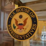 Parents Just Got A New Reason To Question The Scouts U.S. House of Representatives seal on glass door.