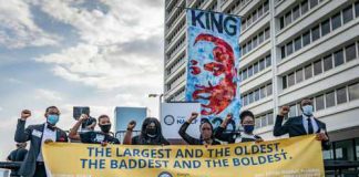 Group of activists holding a banner at a protest event