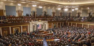 Shadow LLC Drains Union Cash Large assembly in a government legislative chamber.