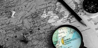 Lai’s Warning: ‘Democratic Taiwan Must Not Become China’s Taiwan’ Magnifying glass highlighting Taiwan on a map