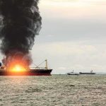 Ports Pounded, Risks Rocket Higher Cargo ship on fire with thick black smoke at sea