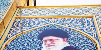 Wounded Ruler Rumors Jolt Pentagon Mural of Ali Khamenei with decorative background and text