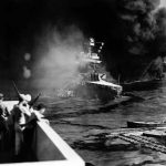 Navy Fire Cluster Aboard Ships Becoming Major Threat A naval ship engulfed in smoke and flames with military personnel observing from a distance