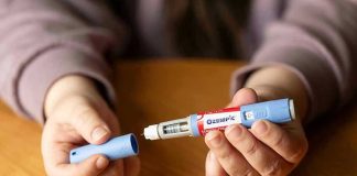 ‘Zombie Filler’ Is the Latest Bizarre Ozempic Trend Hands holding an Ozempic injection pen.