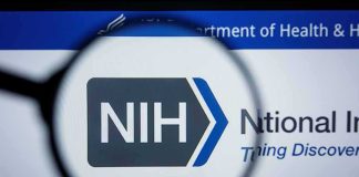 Most Americans Would Never Guess NIH Funds This Magnifying glass focuses on NIH logo on a website