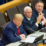 Trump’s War-Deal Gambit Stuns Tehran three men in suits seated at a conference table
