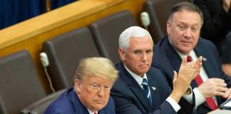 Trump’s War-Deal Gambit Stuns Tehran three men in suits seated at a conference table