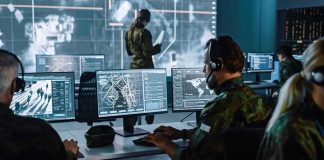 California City Declares Emergency After Crippling Cyberattack Military analysts at computers in a command center