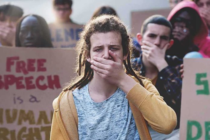 Protester covering mouth during rally