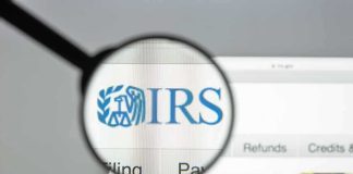 IRS Crackdown Teased — But Here’s The Catch Magnifying glass highlighting IRS logo on a website