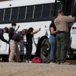 Tourist Dies After ICE Stop Border patrol officers investigating people near a bus.