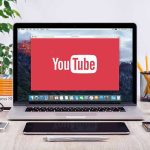 Oprah Guest Makes Lindsay Clancy About RACE YouTube logo on a laptop screen on desk.