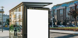 bus stop shelter with blank advertisement poster in city street