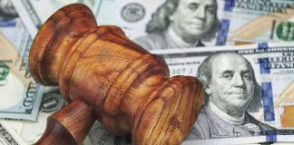 Trump’s Price Relief Plans Keep Hitting Walls Wooden judge's gavel on scattered US dollar bills