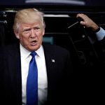 Trump’s Would-Be Assassin Shopped Under THIS Name man in suit stepping out of a vehicle