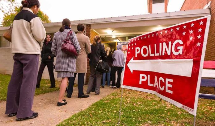 shutterstock_1047600649 Voters standing in line outside a polling place