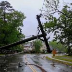 Residents Push Back… The Left Calls It ‘Racism’ Fallen utility poles blocking a wet suburban street