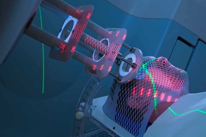 Patient undergoing head radiotherapy with laser alignment and immobilization mask