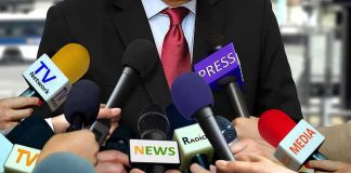 White House Press Fight Gets a NEW Ruling Press microphones surround a suited spokesperson