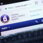 Smartphone showing CIA website in a denim pocket