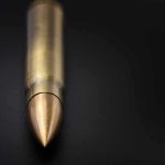 Hamas Kill Plots Exposed in Europe Close-up of a single brass bullet on a dark surface