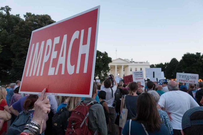 shutterstock_1138805915 Protest crowd with signs outside a government building; Nate Solder present