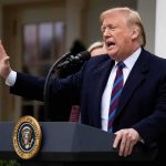 Trump Imminent Peace Deal With Iran Donald Trump speaking at a podium outdoors