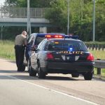 Freeway War Zone Erupts in L.A. Police officer conducting a traffic stop on a highway