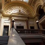 Shock Ruling From 1898 Now Runs America Grand courthouse interior with domed ceiling and staircase